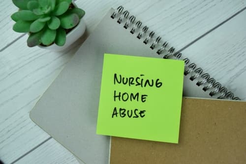 nursing home abuse post-it on desk