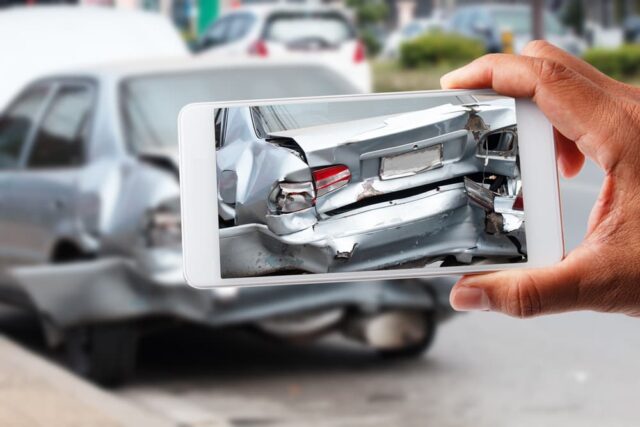 Taking photos of accident scene for evidence